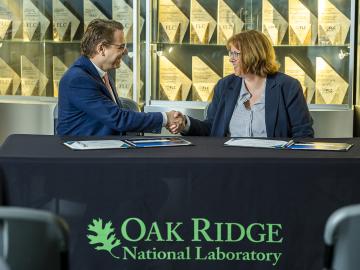 Hood Whitson, chief executive officer of Element3, and Cynthia Jenks, associate laboratory director for the Physical Sciences Directorate, shake hands during the Element3 licensing event at ORNL on May 3, 2024. Credit: Carlos Jones/ORNL, U.S. Dept. of Energy