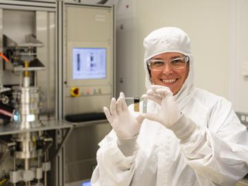 A technician shows off a diamond foil fabricated in the Center for Nanophase Materials Sciences clean room. 