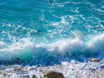 Waves crashing on beach (Envato Elements)