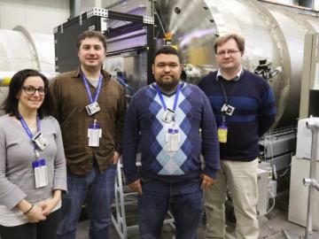 Researchers from NIST and the University of Maryland standing in front of the Bio-SANS equipment.