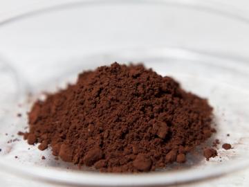 Dark brown powder that is a rare earth element that has been refined into powder