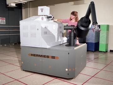 Baldwin with the HERMIES III robot at ORNL in 1988. Photo courtesy, ORNL. Baldwin with the HERMIES III robot at ORNL in 1988. Photo courtesy, ORNL.