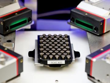 A second generation of the Pu-238 pellet automated metrology system being developed in an ORNL lab. A second generation of the Pu-238 pellet automated metrology system being developed in an ORNL lab.