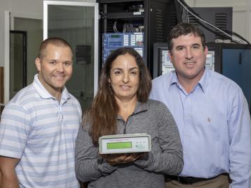 L-R, Researchers Nils Stenvig, Isabelle Snyder and Travis Smith are developing tools and deploying sensors to aid decision-making as Puerto Rico rebuilds and modernizes its power grid.