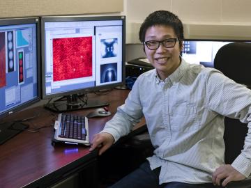 ORNL’s Xiahan Sang unambiguously resolved the atomic structure of MXene, a 2D material promising for energy storage, catalysis and electronic conductivity. Image credit: Oak Ridge National Laboratory, U.S. Dept. of Energy; photographer Carlos Jones