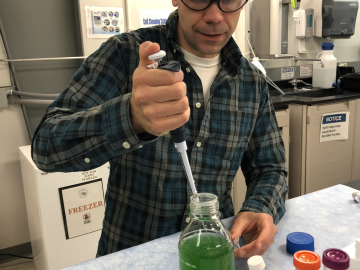 Postdoctoral researcher Cory Knoot prepares a sample of blue-green algae for neutron scattering experiment on the Bio-SANS instrument at ORNL’s High Flux Isotope Reactor. Credit: Kelley Smith/Oak Ridge National Laboratory, U.S. Dept. of Energy