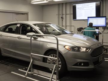 ORNL’s Frank Combs and Michael Starr of the U.S. Armed Forces (driver) work in ORNL’s Vehicle Security Laboratory to evaluate a prototype device that can detect network intrusions in all modern vehicles. Credit: Carlos Jones/ORNL, U.S. Dept. of Energy ORNL’s Frank Combs and Michael Starr of the U.S. Armed Forces (driver) work in ORNL’s Vehicle Security Laboratory to evaluate a prototype device that can detect network intrusions in all modern vehicles. Credit: Carlos Jones/ORNL, U.S. Dept. of Energy