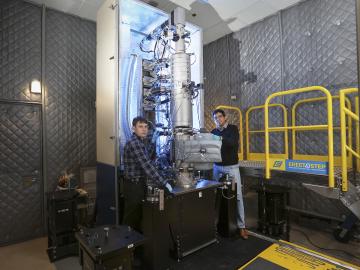 From left, Andrew Lupini and Juan Carlos Idrobo use ORNL’s new monochromated, aberration-corrected scanning transmission electron microscope, a Nion HERMES to take the temperatures of materials at the nanoscale. Image credit: Oak Ridge National Laboratory