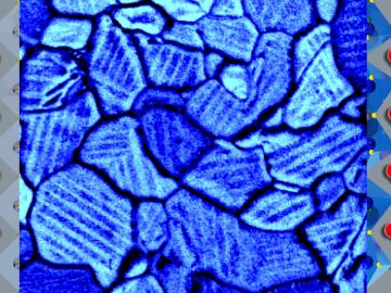 In a thin film of a solar-energy material, molecules in twin domains (modeled in left and right panels) align in opposing orientations within grain boundaries (shown by scanning electron microscopy in the center panel).