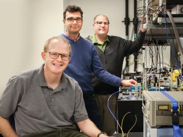 Joseph Lukens, Pavel Lougovski and Nicholas Peters (from left), researchers with ORNL’s Quantum Information Science Group, are examining methods for encoding photons with quantum information that are compatible with the existing telecommunications infrast Joseph Lukens, Pavel Lougovski and Nicholas Peters (from left), researchers with ORNL’s Quantum Information Science Group, are examining methods for encoding photons with quantum information that are compatible with the existing telecommunications infrast