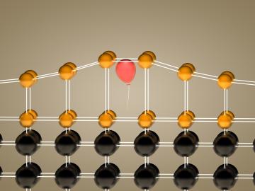 Inserting helium atoms (visualized as a red balloon) into a crystalline film (gold) allowed Oak Ridge National Laboratory researchers to control the material’s elongation in a single direction. Inserting helium atoms (visualized as a red balloon) into a crystalline film (gold) allowed Oak Ridge National Laboratory researchers to control the material’s elongation in a single direction.