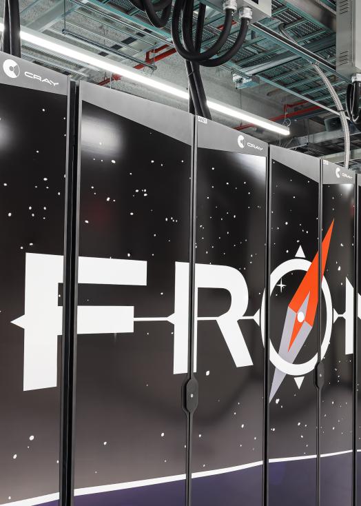 Image of the Frontier logo across the front cabinets of the Frontier supercomputer.