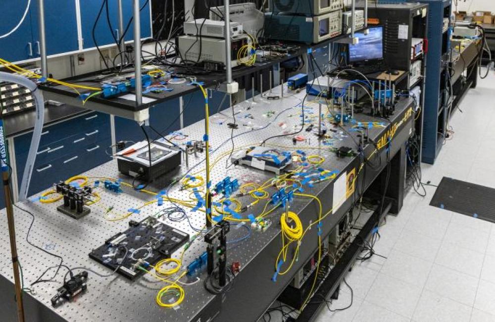 A team from the U.S. Department of Energy’s Oak Ridge National Laboratory, Stanford University and Purdue University developed and demonstrated a novel, fully functional quantum local area network, or QLAN, to enable real-time adjustments to information shared with geographically isolated systems at ORNL using entangled photons passing through optical fiber. Credit: Carlos Jones/ORNL, U.S. Dept. of Energy