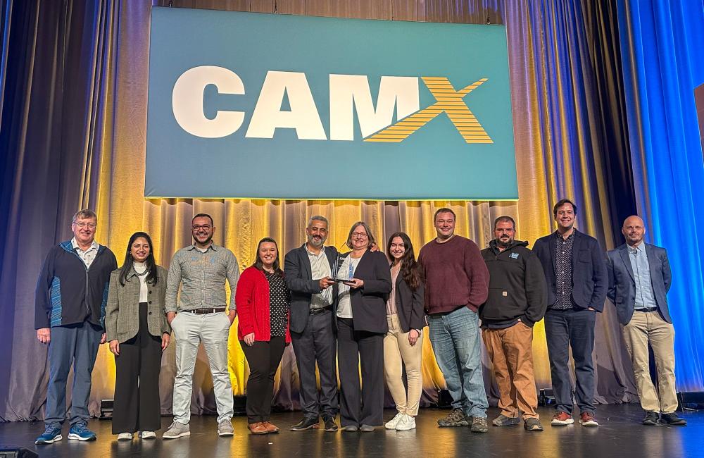 SM2ART team members receive the CAMX Combined Strength Award at the Georgia World Congress Center in Atlanta. Pictured here are, from left, ORNL’s Dan Coughlin, Sana Elyas, Halil Tekinalp, Amber Hubbard, Soydan Ozcan; University of Maine’s Susan MacKay, Angelina Buzzelli, Scott Tomlinson, Wesley Bisson; and ORNL’s Matt Korey and Vlastimil Kunc. Credit: University of Maine