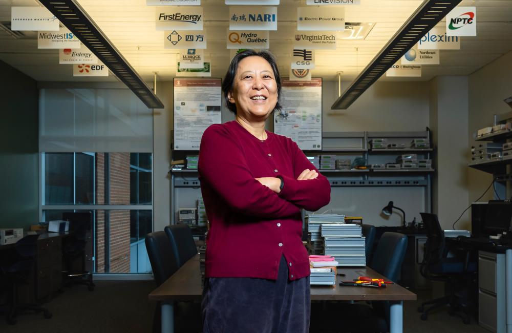ORNL researcher Yilu Liu poses in office