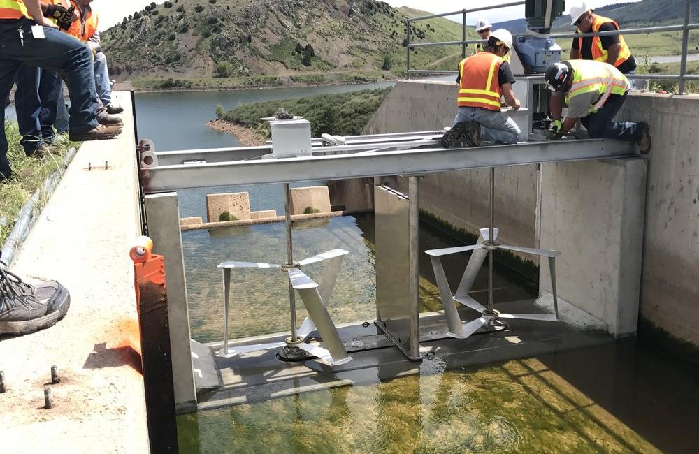 construction crew installing composites at hydropower facility