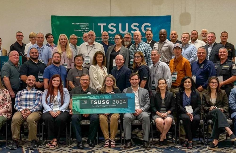 Group photo at the TSUSG 2024 annual conference There are three rows of people totaling about 60 people n a conference room