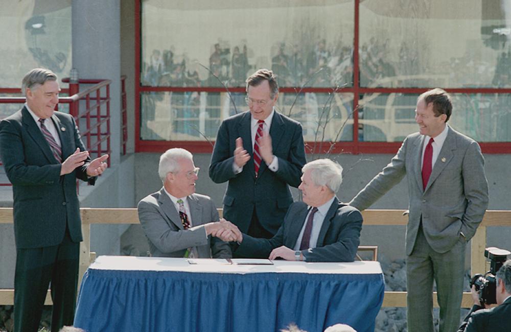 On the podium on Feb. 19, 1992, for a CRADA signing were Energy Secretary James Watkins, CoorsTek President Joe Coors Jr., President George Bush, ORNL Director Al Trivelpiece and then-Secretary of Education Lamar Alexander.