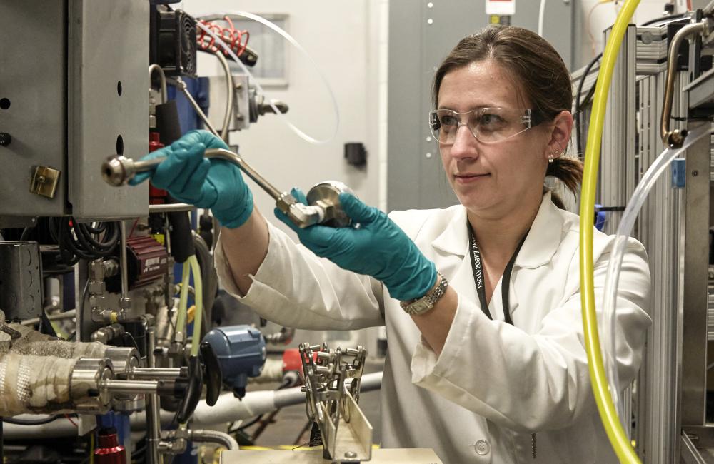 Melanie Debusk collects soot samples from a reactivity controlled compression ignition engine at Oak Ridge National Laboratory’s National Transportation Research Center.