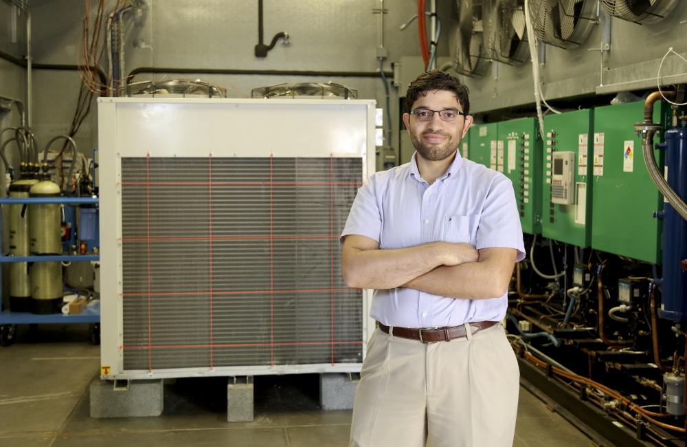 Omar Abdelaziz in ORNL’s Maximum Building Energy Efficiency Research Laboratory (MAXLAB). Photo credit: Jason Richards