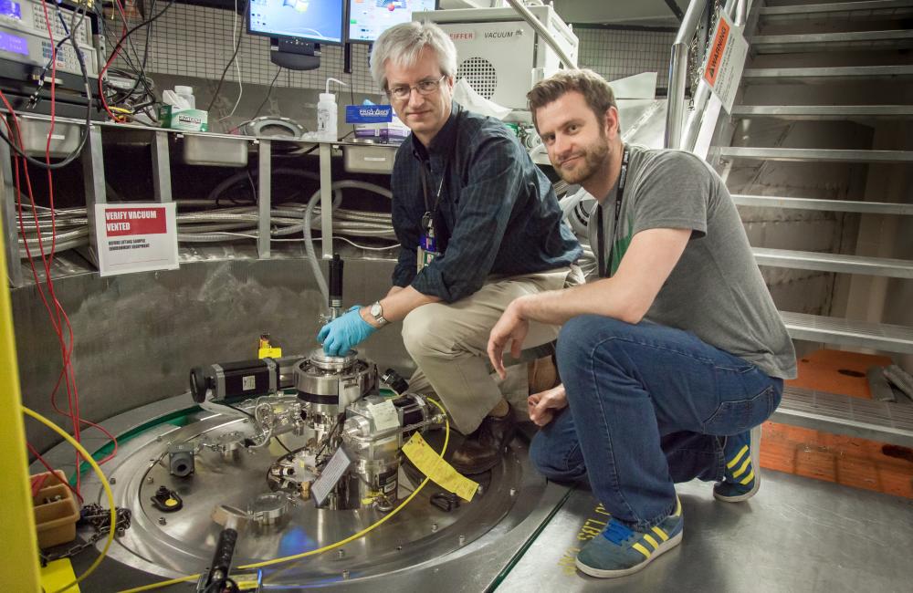Doug Abernathy, left, ARCS instrument scientist at Oak Ridge National Laboratory, and Marc Janoschek, Los Alamos National Laboratory, prepare their sample for experiments at the Spallation Neutron Source.