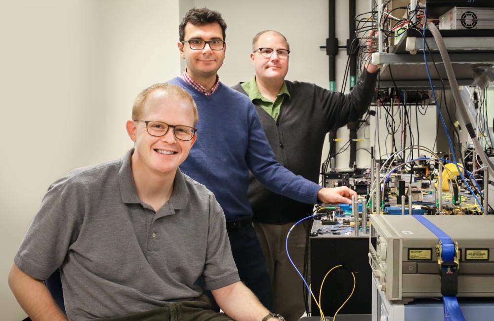 Joseph Lukens, Pavel Lougovski and Nicholas Peters (from left), researchers with ORNL’s Quantum Information Science Group, are examining methods for encoding photons with quantum information that are compatible with the existing telecommunications infrast
