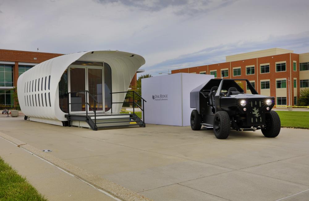 Oak Ridge National Laboratory's Additive Manufacturing Integrated Energy  (AMIE) demonstration connects a 3D-printed building and vehicle to showcase a new approach to energy use, storage and consumption. Photo by Carlos Jones