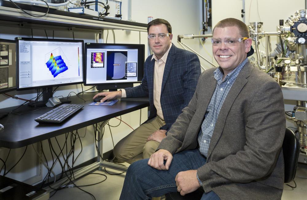 ORNL software engineer Eric Lingerfelt (right) and Stephen Jesse (left) of ORNL’s Center for Nanophase Materials Sciences led the development of the Bellerophon Environment for Analysis of Materials (BEAM).