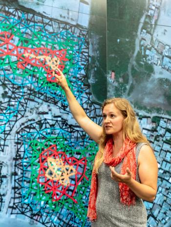 Research scientist Christa Brelsford explained a mathematical framework she developed in 2018, which showed increased availability of infrastructure didn’t necessarily reduce inequality in its access. Credit: Carlos Jones/ORNL, U.S. Dept. of Energy