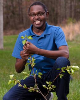 Dr. Muchero with a poplar tree