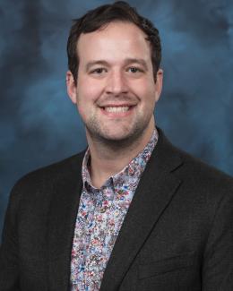 A headshot of Dr. Matthew Korey